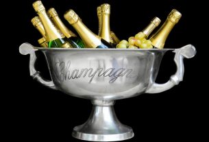 An ice bucket filled with champagne bottles