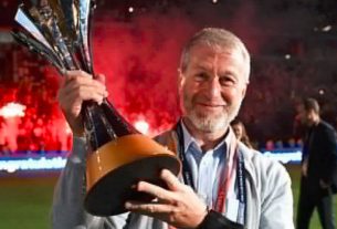 Roman Abramovich pictured with a trophy won by his football team.