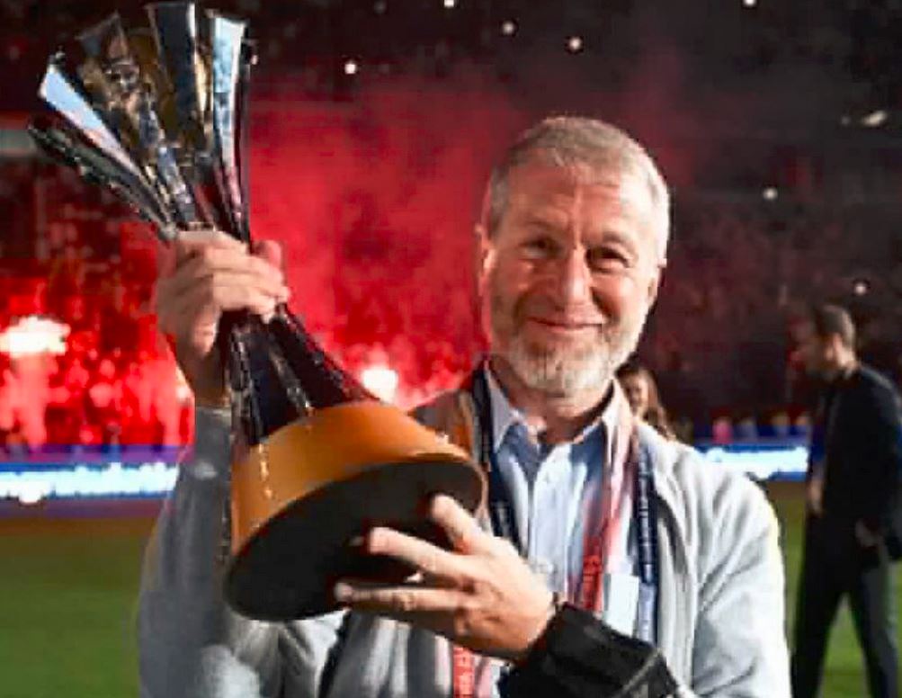 Roman Abramovich pictured with a trophy won by his football team.